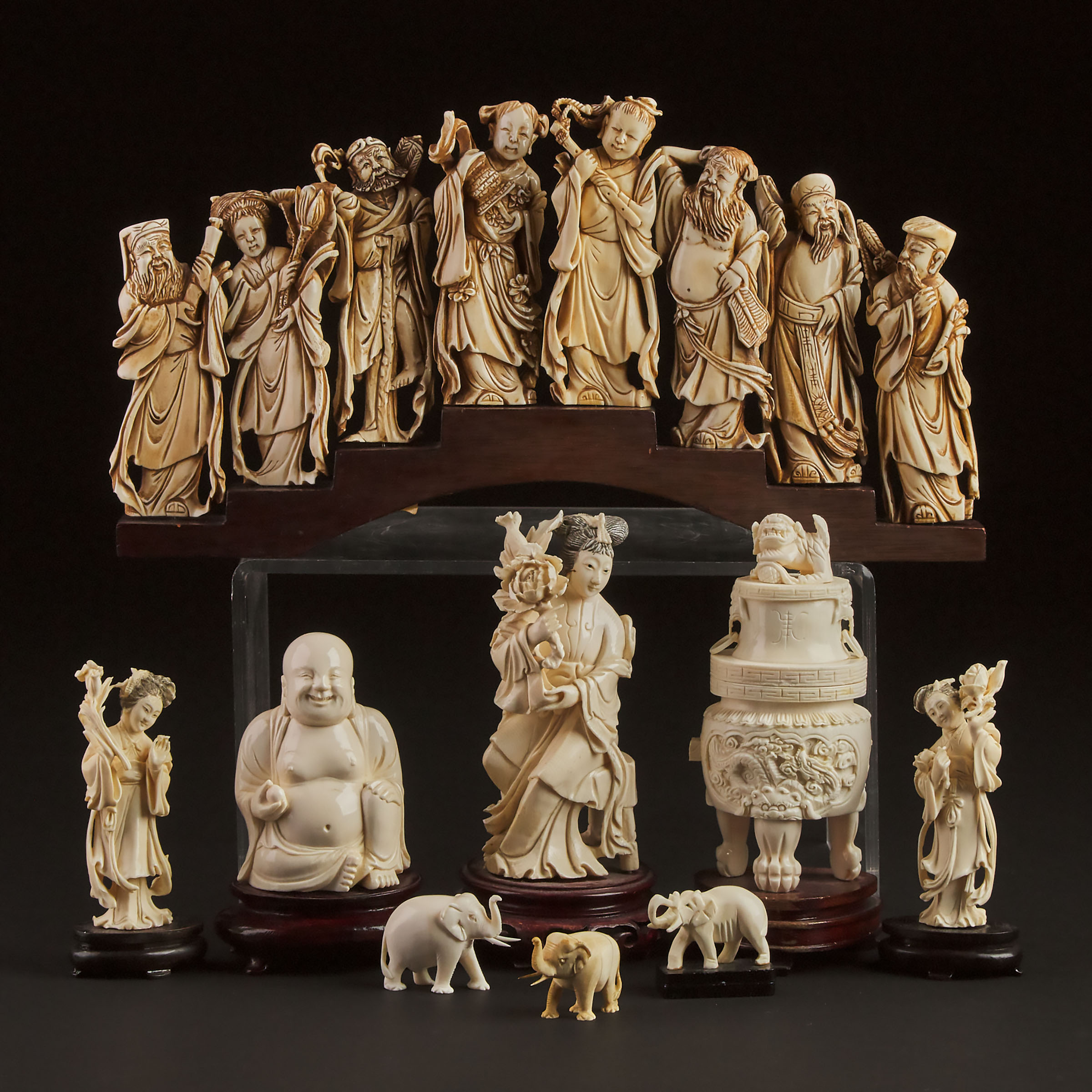 A Group of Nine Chinese Ivory Carvings,