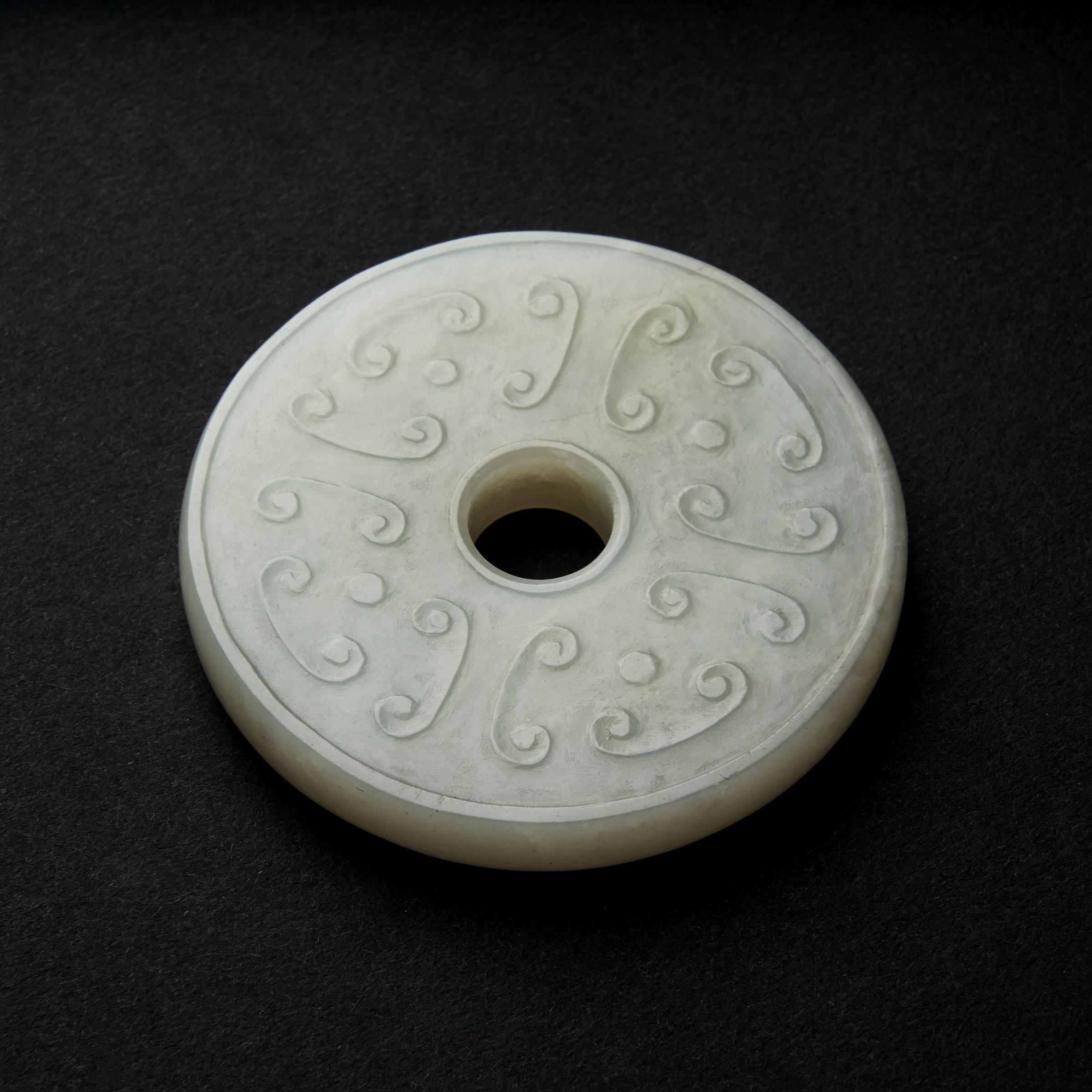 A White Jade Archaistic Bi Disc  3abbe4