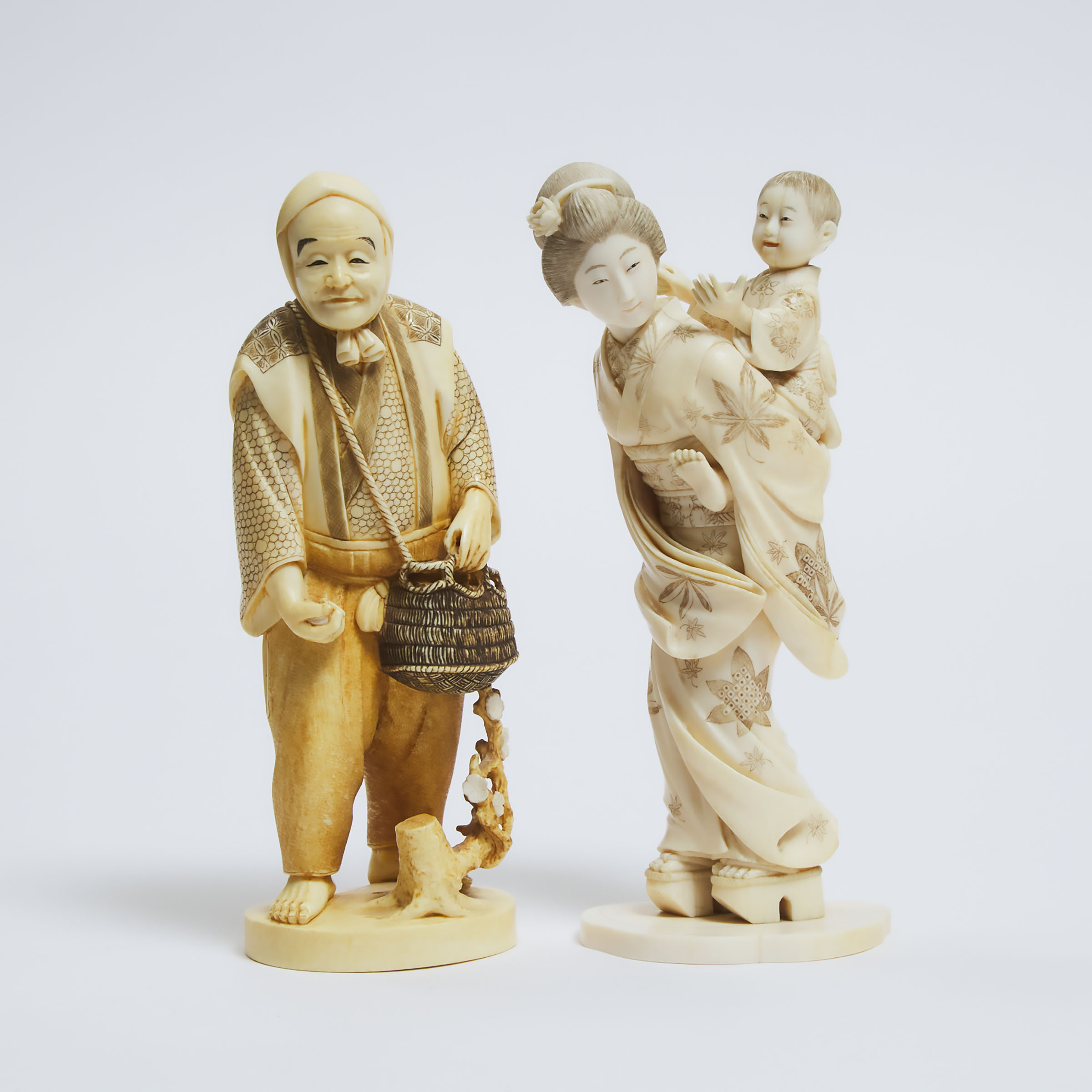 Two Ivory Okimono of a Lady and