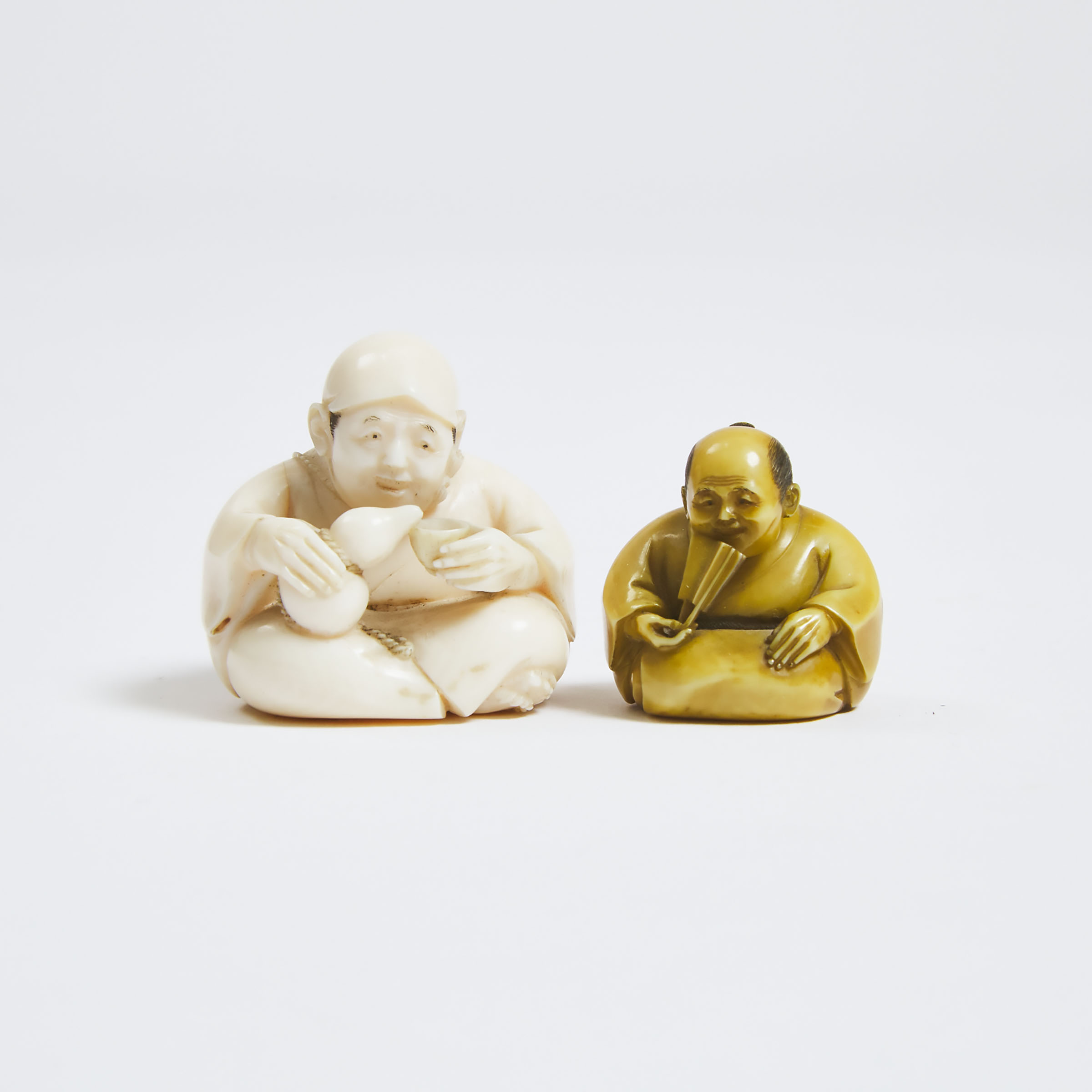 Two Ivory Netsuke of Seated Men,