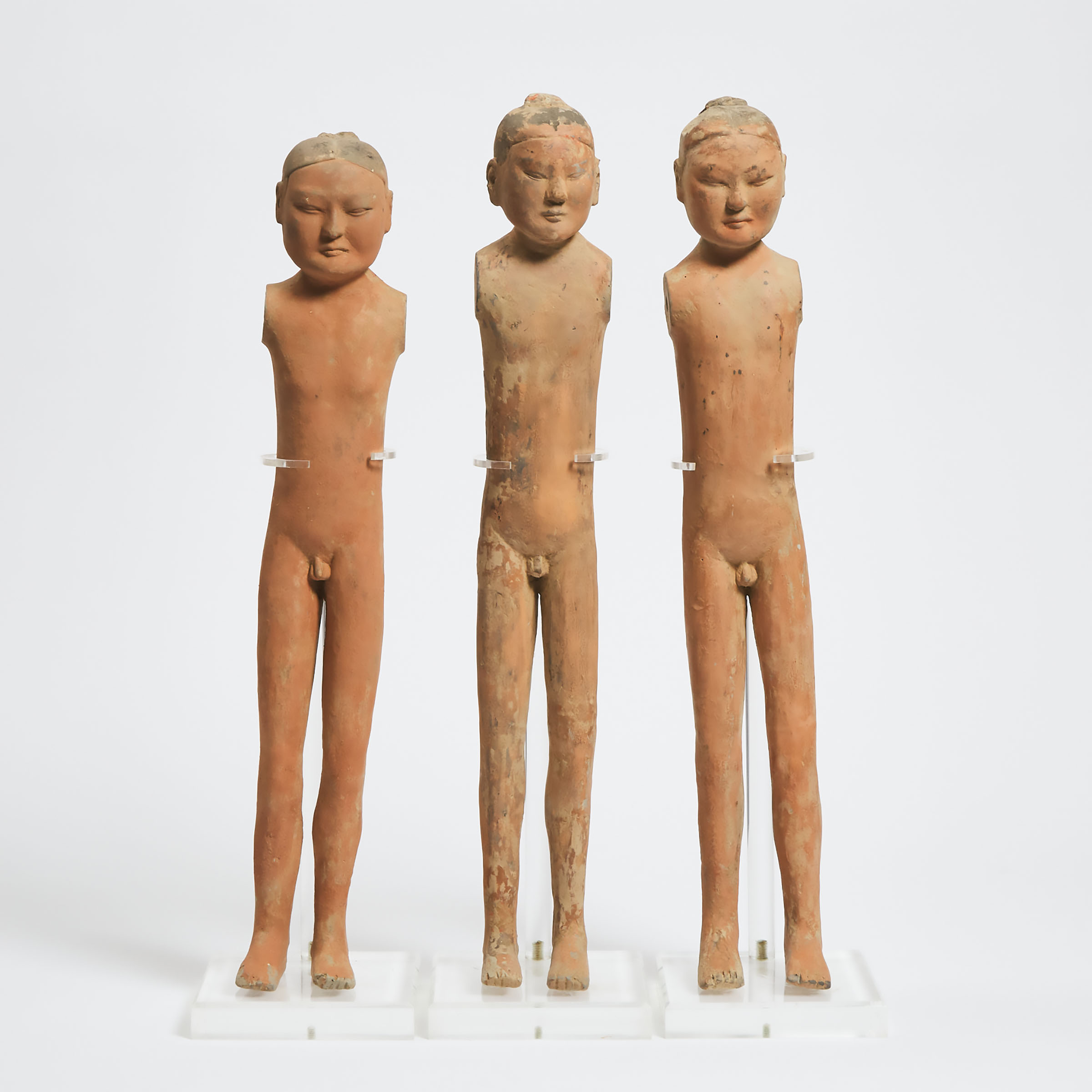A Group of Three Pottery Figures of