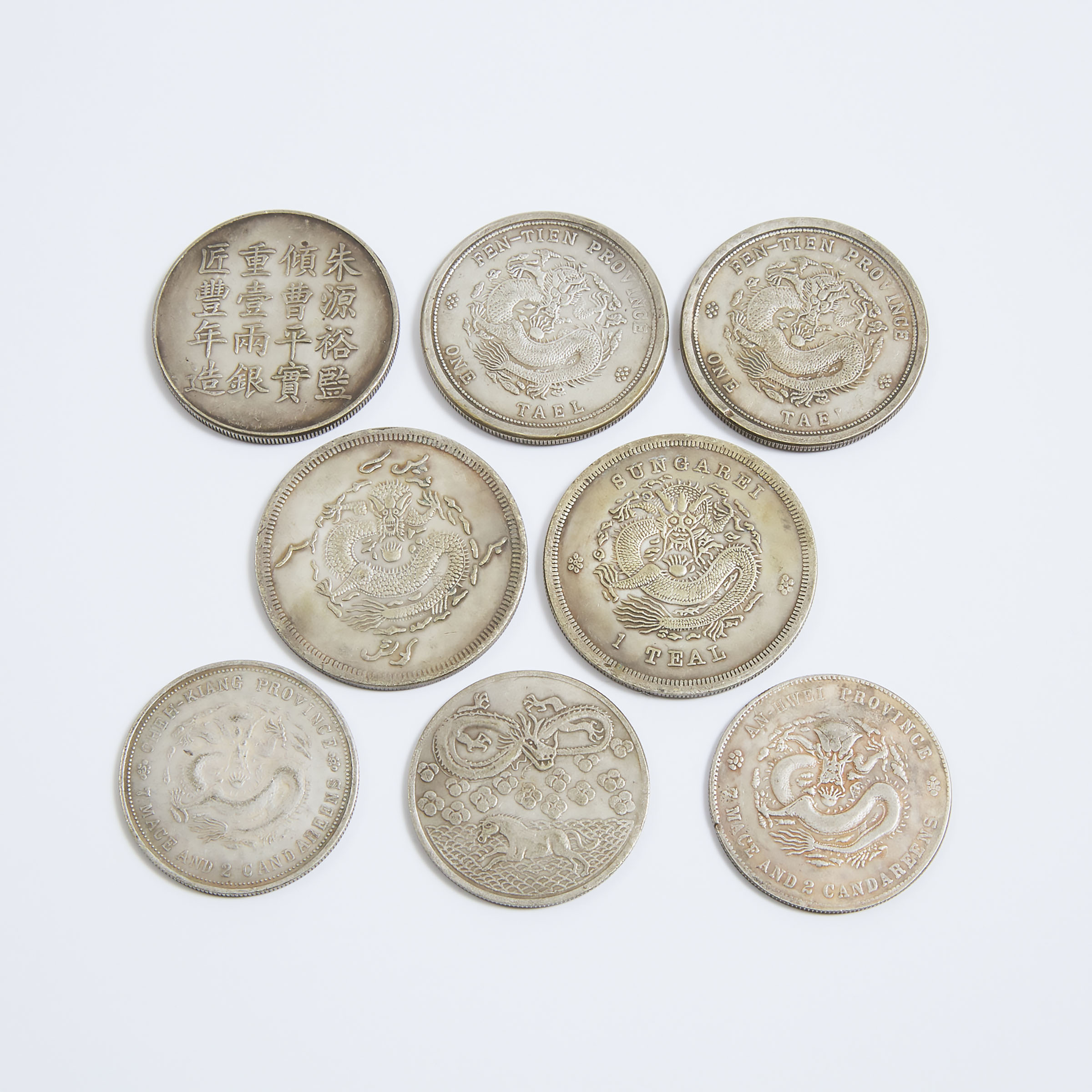 Eight Chinese Silver Coins With