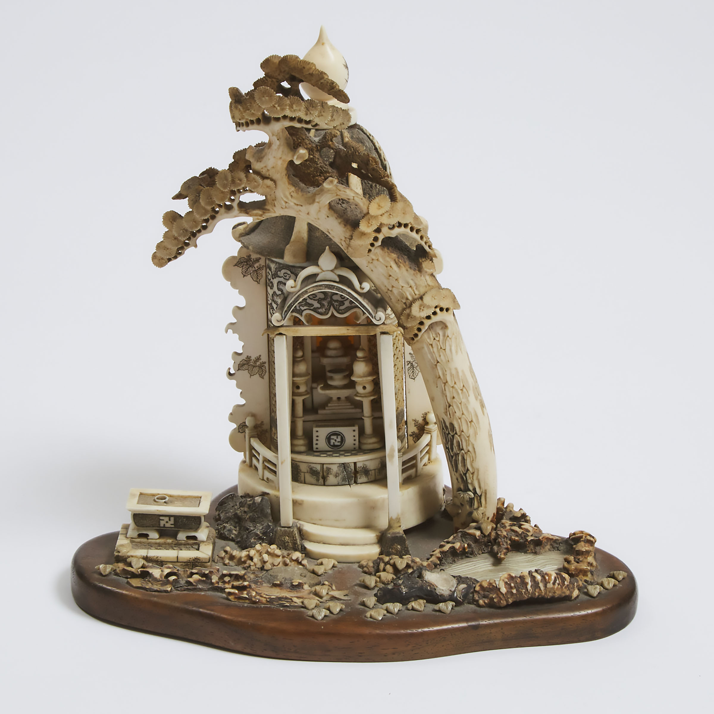 An Ivory Okimono of a Buddhist Shrine,