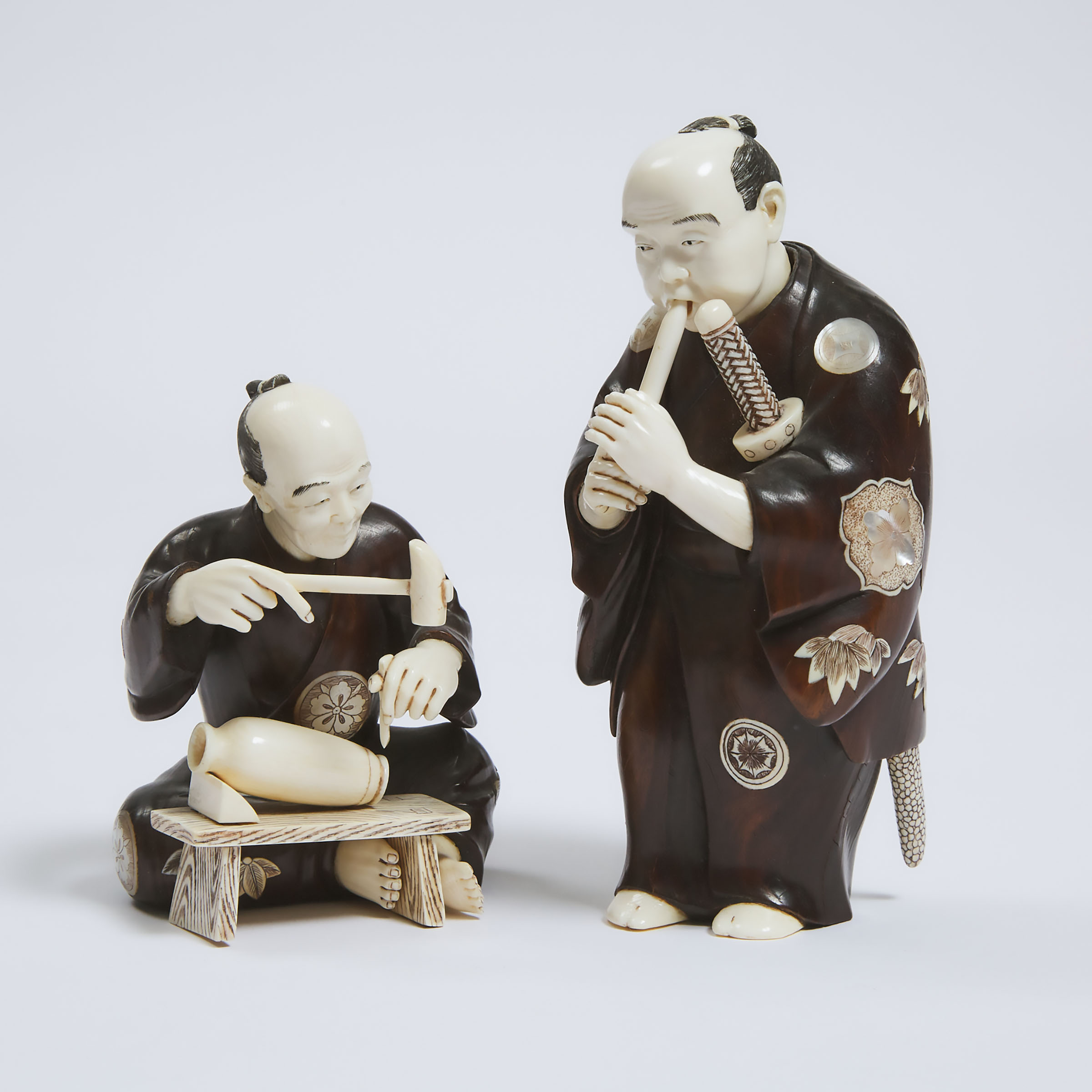 Two Wood and Ivory Okimono of a Samurai