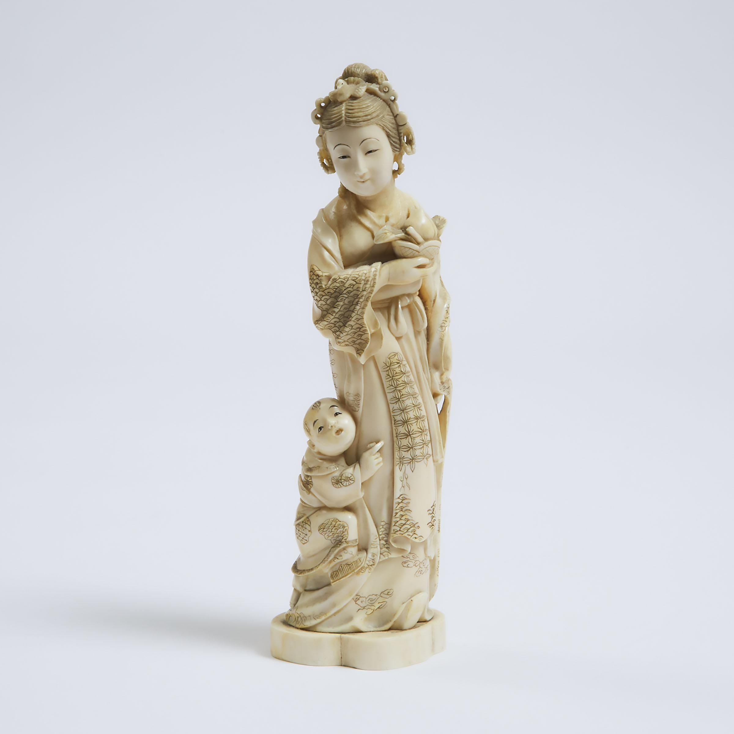 A Carved Ivory Group of a Lady 3abe4a