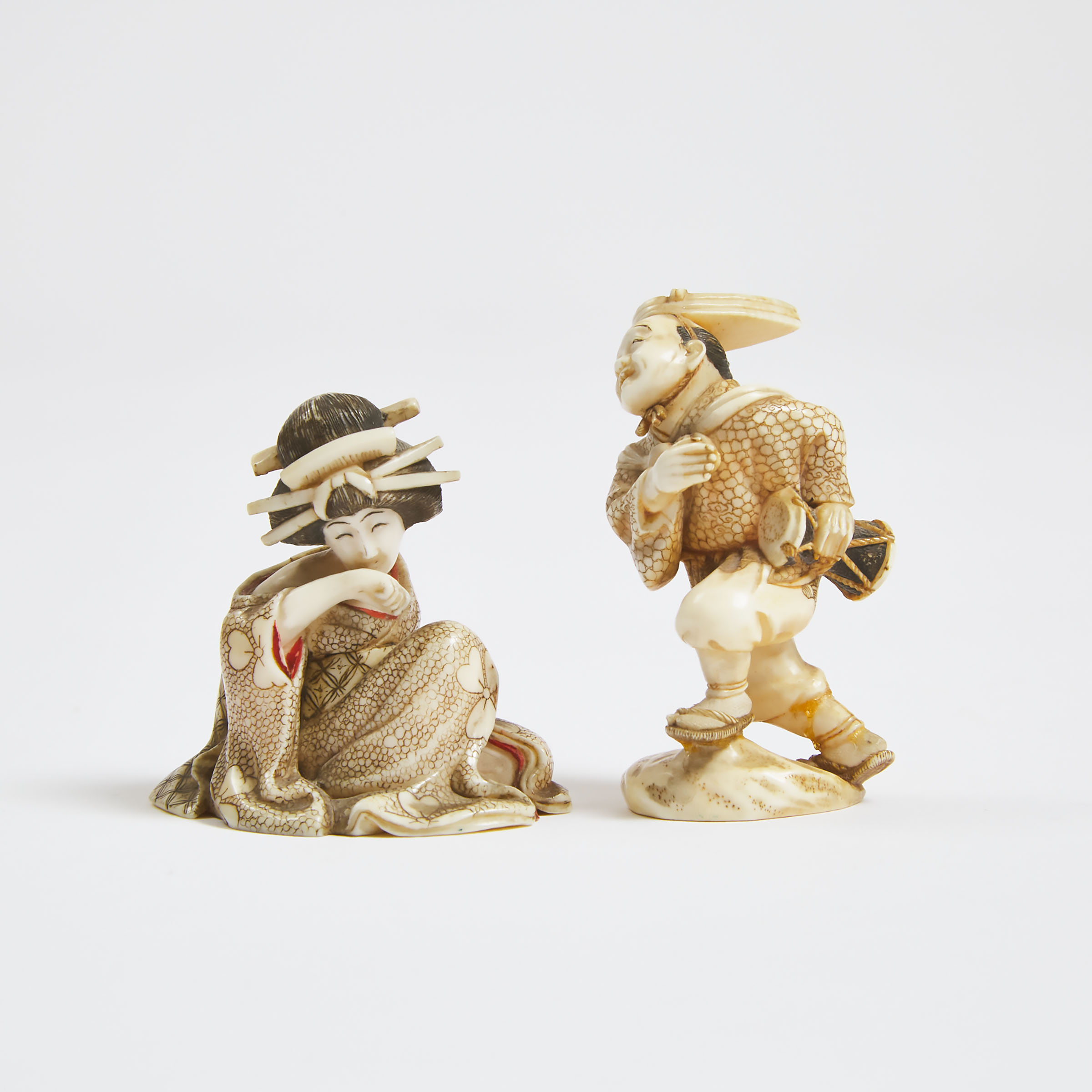 Two Tinted Ivory Netsuke of a Court