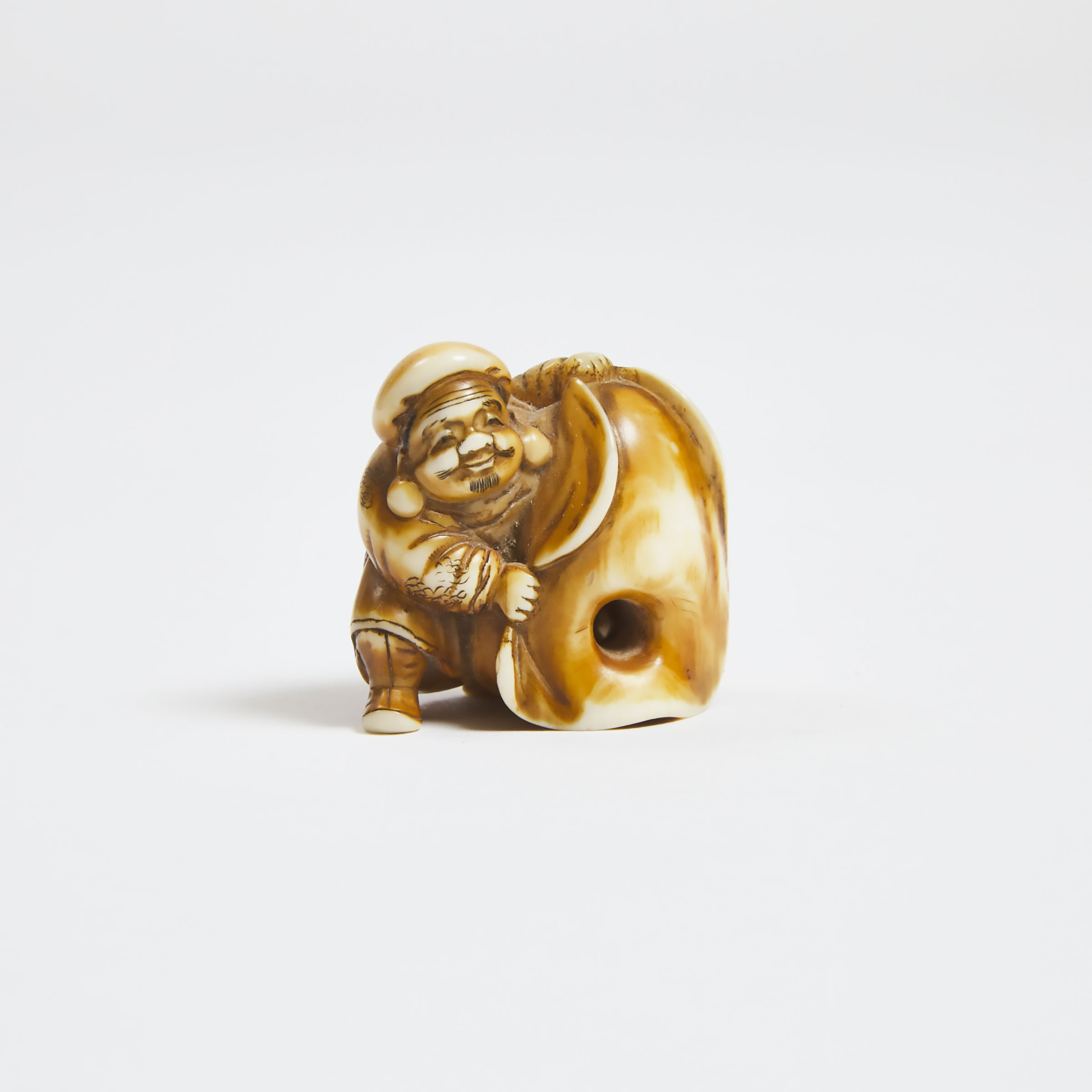 An Ivory Trick Netsuke of Daikoku