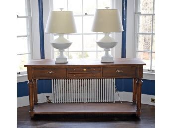 A sideboard/buffet with four drawers,