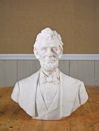 A resin bust sculpture of Abraham Lincoln,