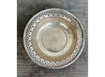 A monogrammed bowl with a pierced