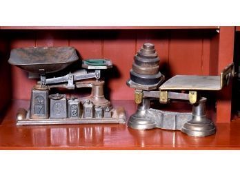 Two antique brass and iron balance scales,