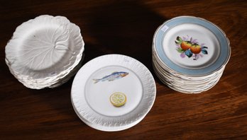 A set of eleven small plates with hand