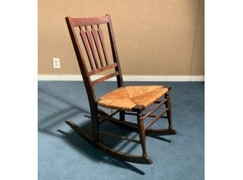 A vintage rocking chair with a