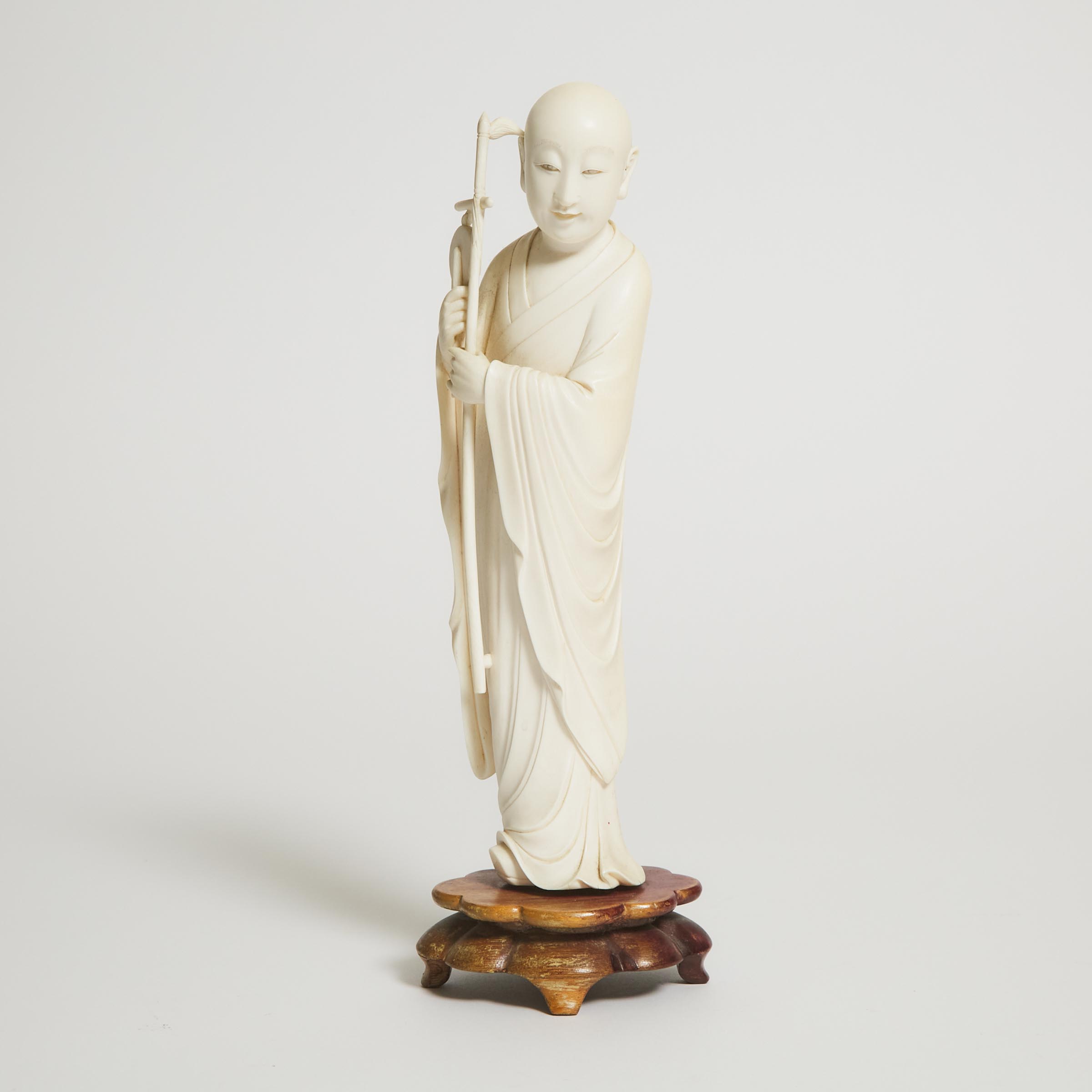 An Ivory Figure of a Buddhist Musician,