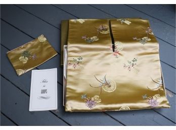 A finely embroidered gold silk