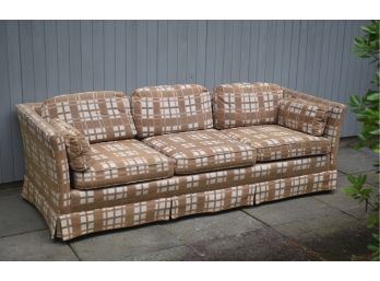A labeled three section plaid upholstered