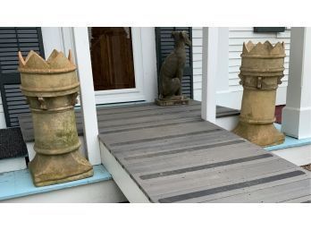 A pair of terracotta turret/castle form