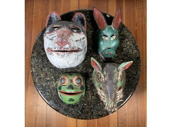 Four animal form painted wood masks  3acf0d