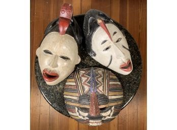 Two 17"H black and white masks