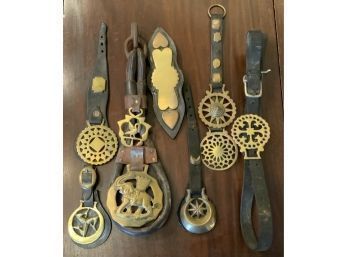 Seven antique leather and brass