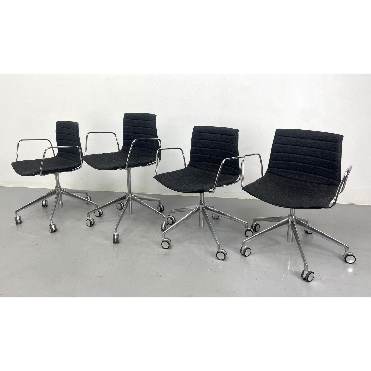 set 4 Arper rolling desk chairs