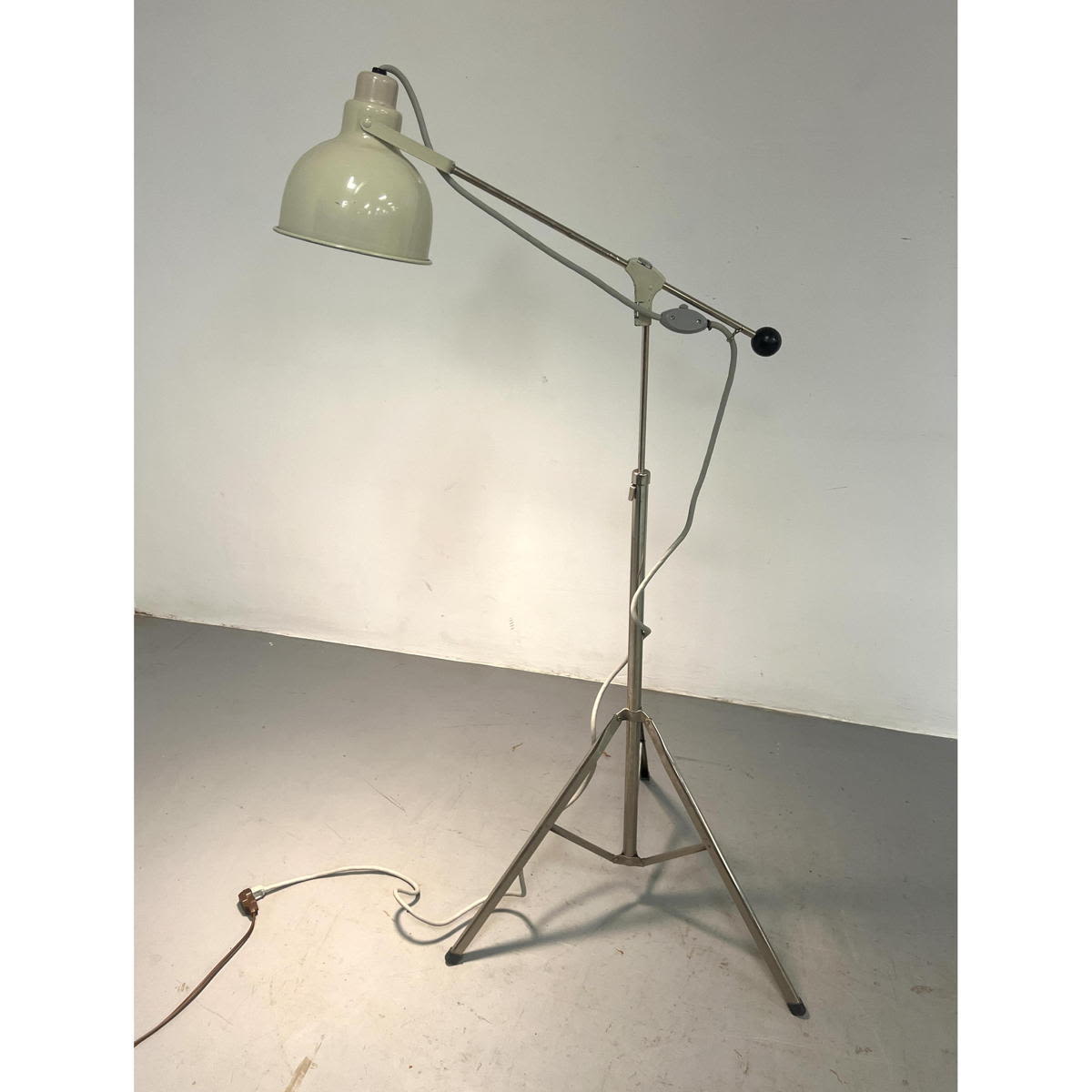 Adjustable white tripod base floor lamp