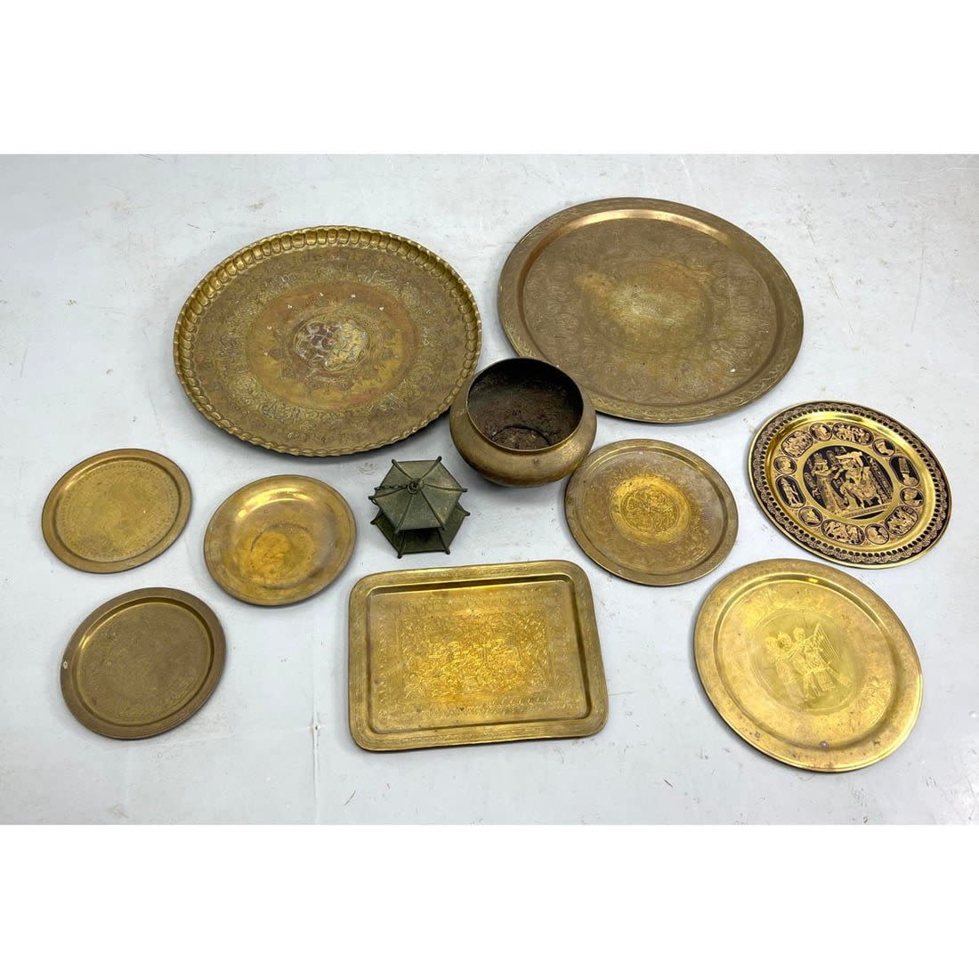 8pc brass trays and urn. Fancy