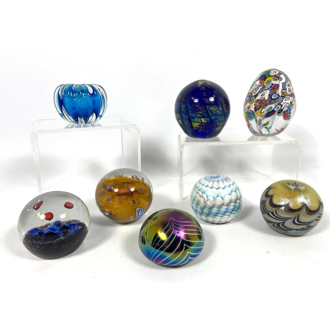 8 Art glass paper weights. Many signed.