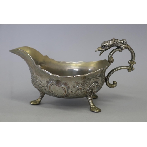 Cast metal griffin handled sauce boat,