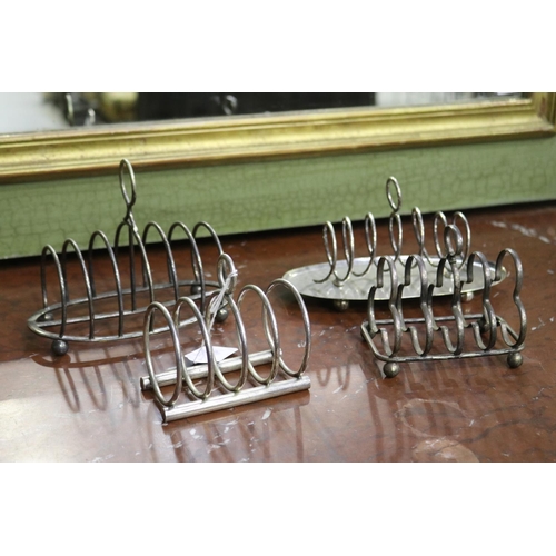 Four silver plate toast racks, approx