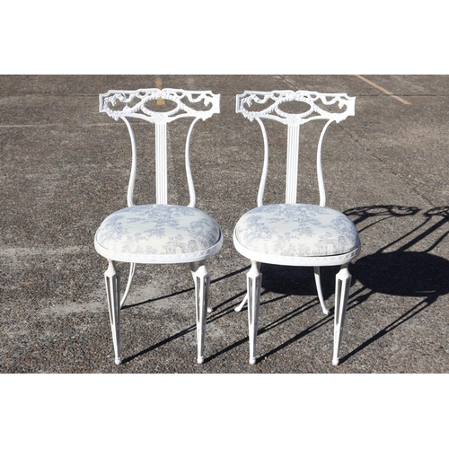 Pair of white metal chairs, each approx