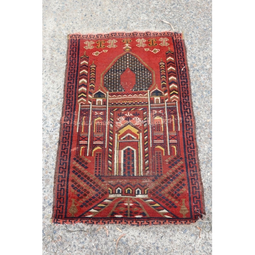 Handwoven red ground temple carpet,