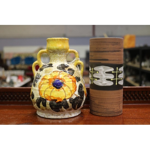 Two pottery vases, one with an Australian