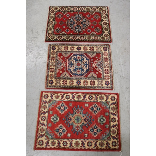 Lot of three red ground handwoven 3adc01