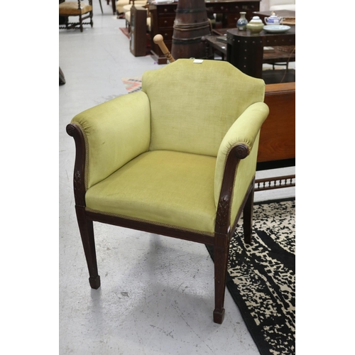 English green upholstered armchair