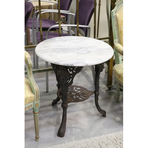 Wrought iron table with marble top,