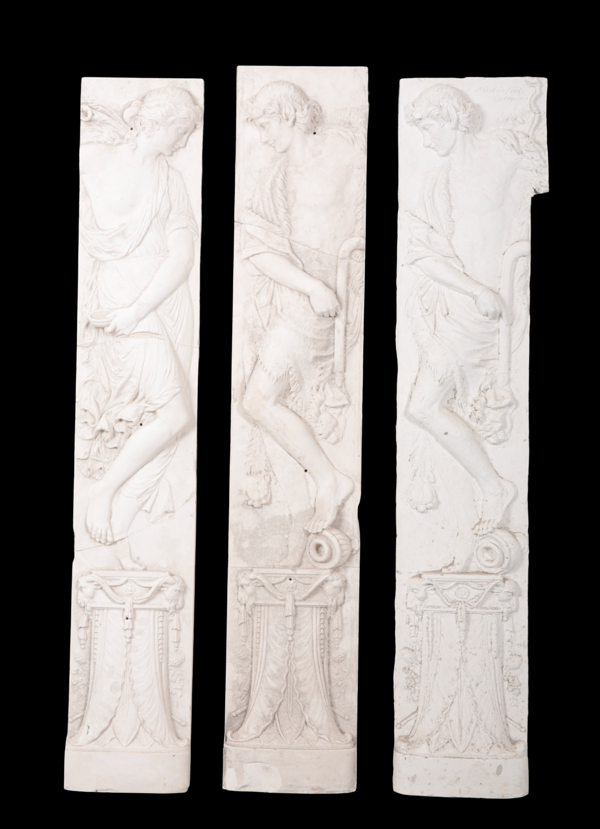 THREE LARGE PLASTER RELIEFS OF