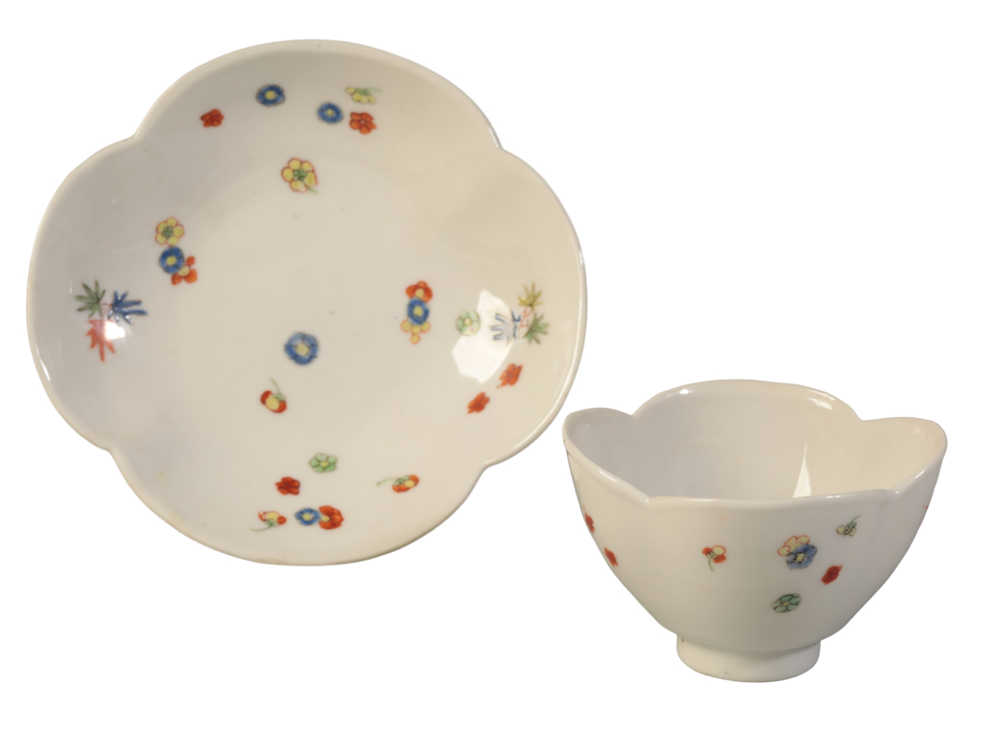 A CHINESE QUATREFOIL CUP AND SAUCER
