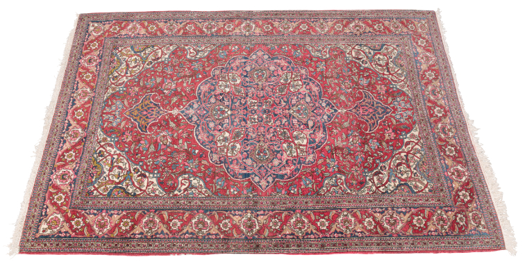 AN ANTIQUE KASHAN RUG woven in