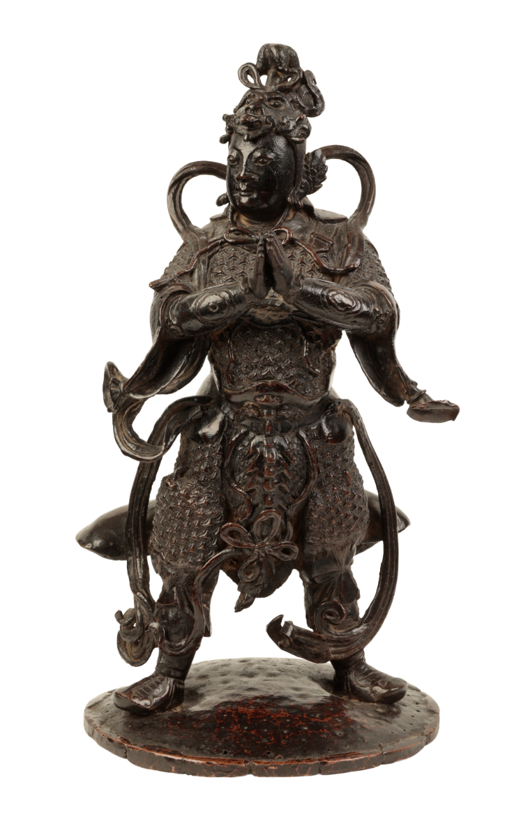 A CHINESE BRONZE STANDING FIGURE