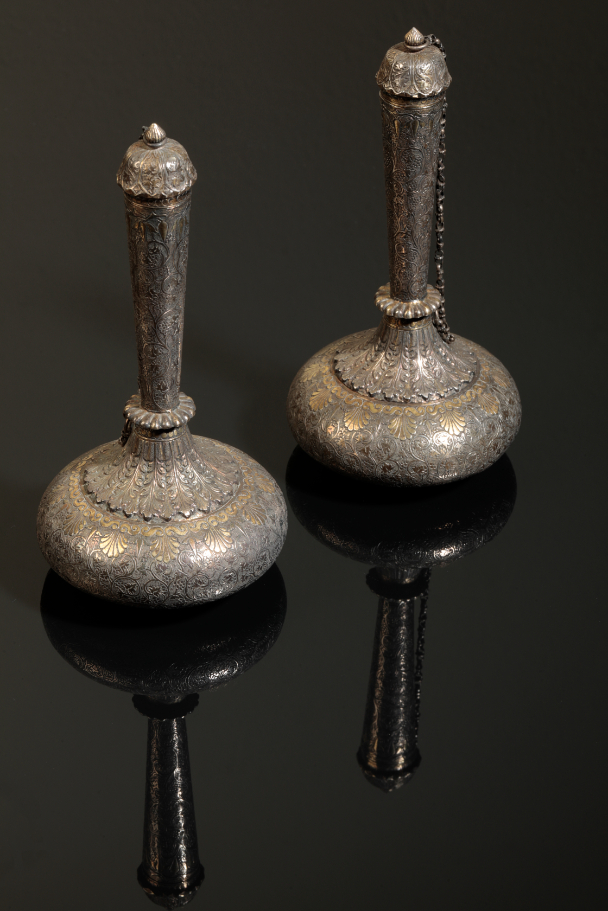 A PAIR OF INDIAN SILVER AND PARCEL GILT 3ae376