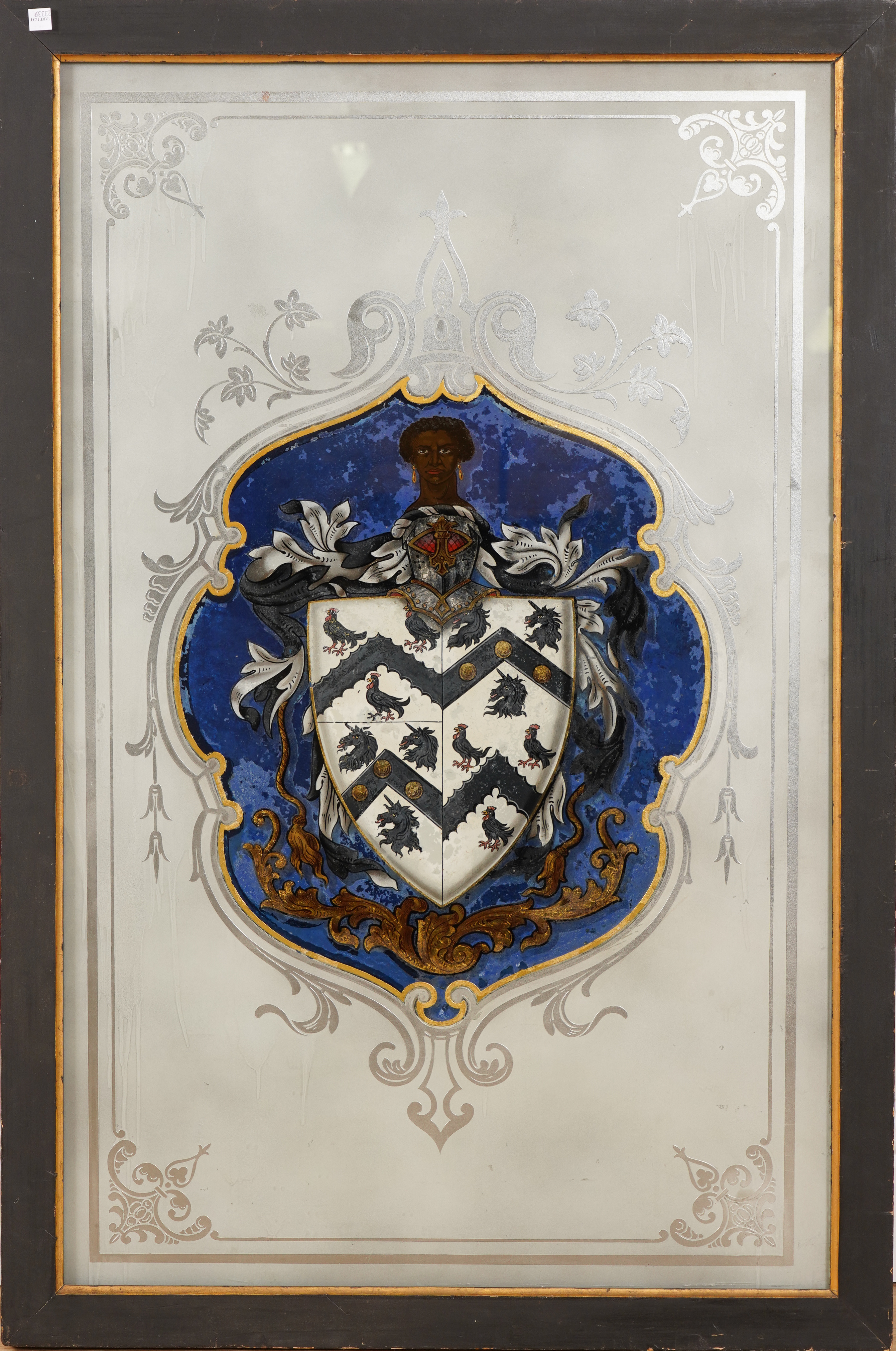 A VERRE EGLOMISE COAT-OF-ARMS OF