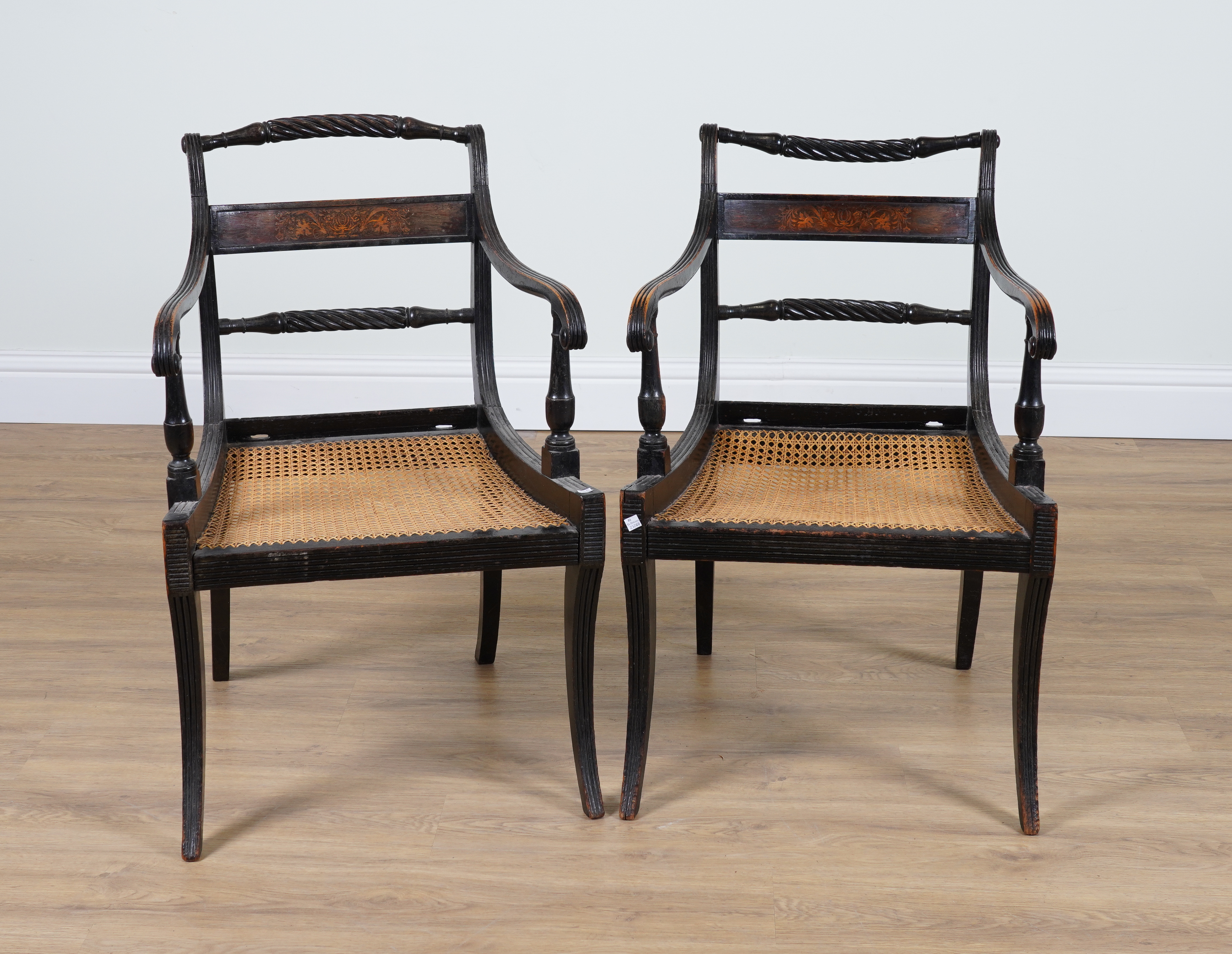 A PAIR OF REGENCY EBONISED BEECH