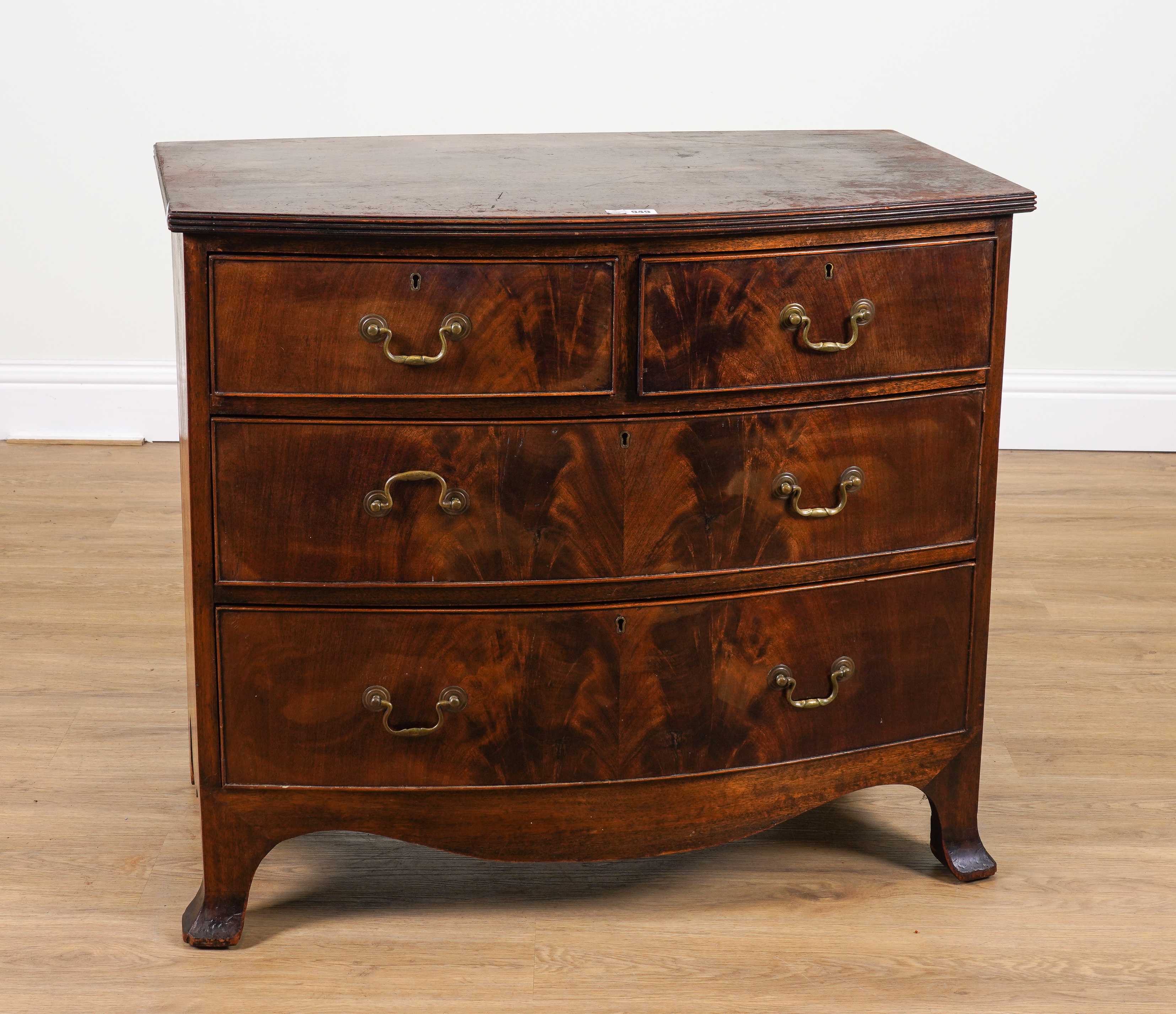 A REGENCY MAHOGANY BOWFRONT FOUR DRAWER