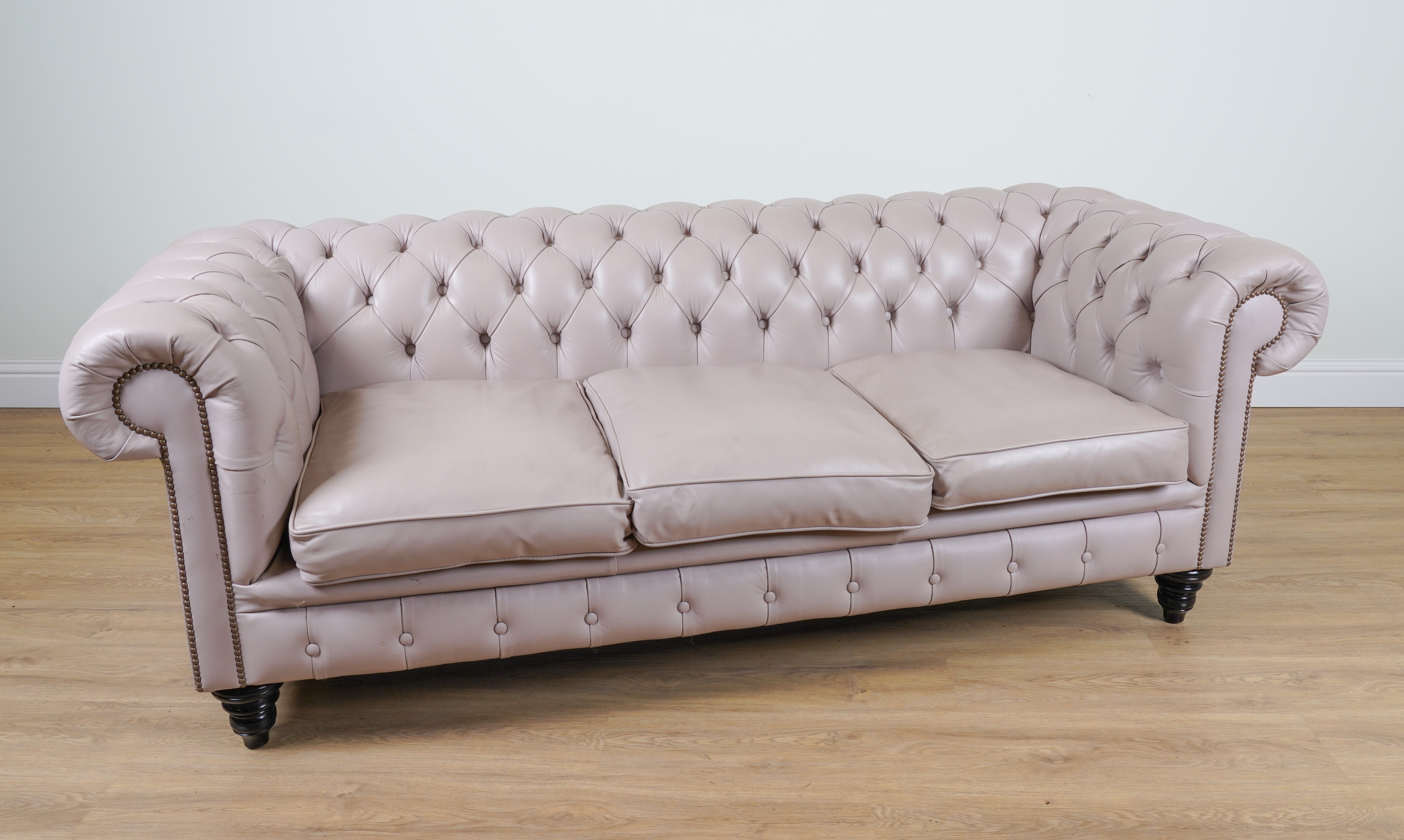 A MODERN BRASS STUDDED LILAC LEATHER