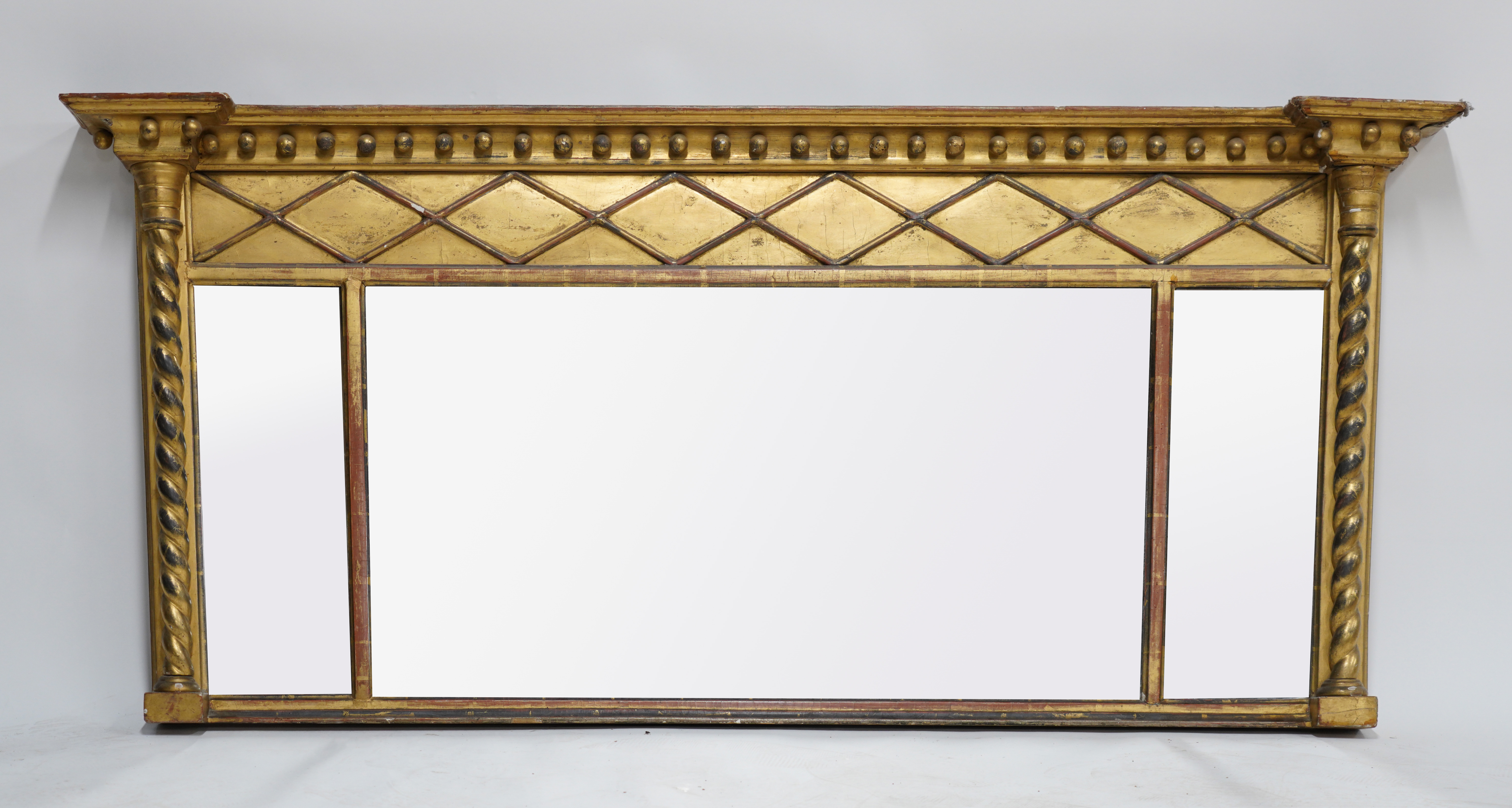 A REGENCY GILT FRAMED TRIPLE PLATE 3ae539