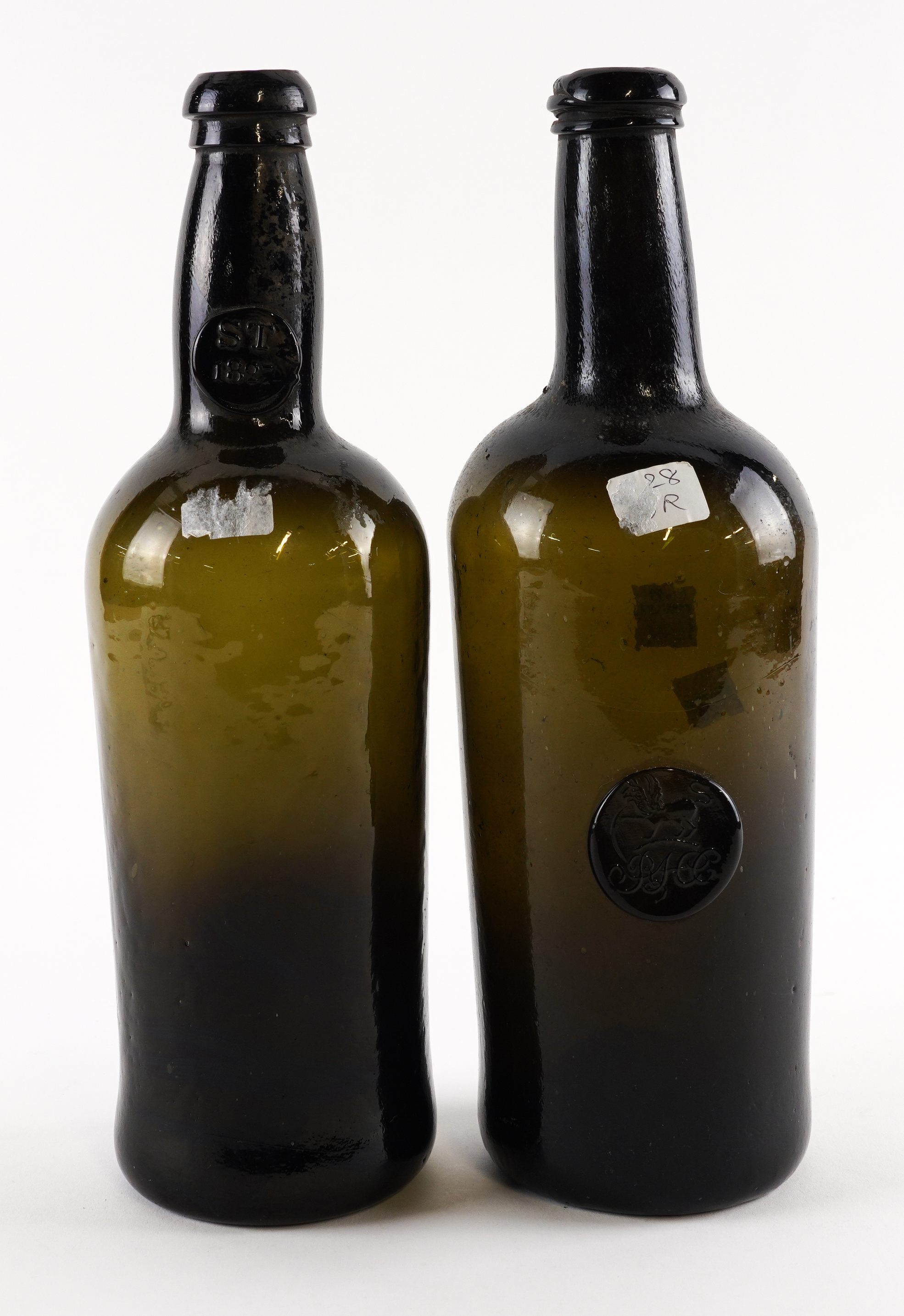 TWO `BLACK GLASS' SEALED WINE BOTTLES