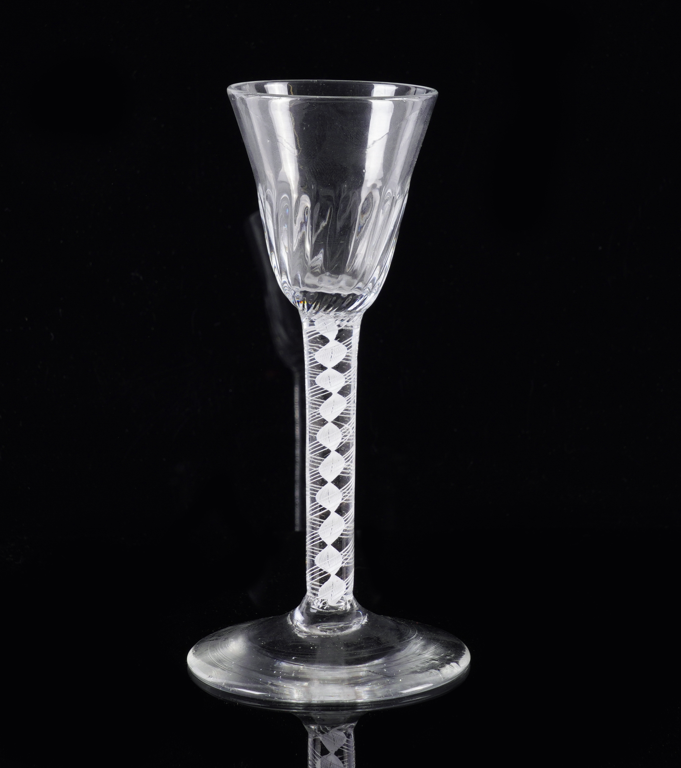 AN OPAQUE TWIST WINE GLASS Circa