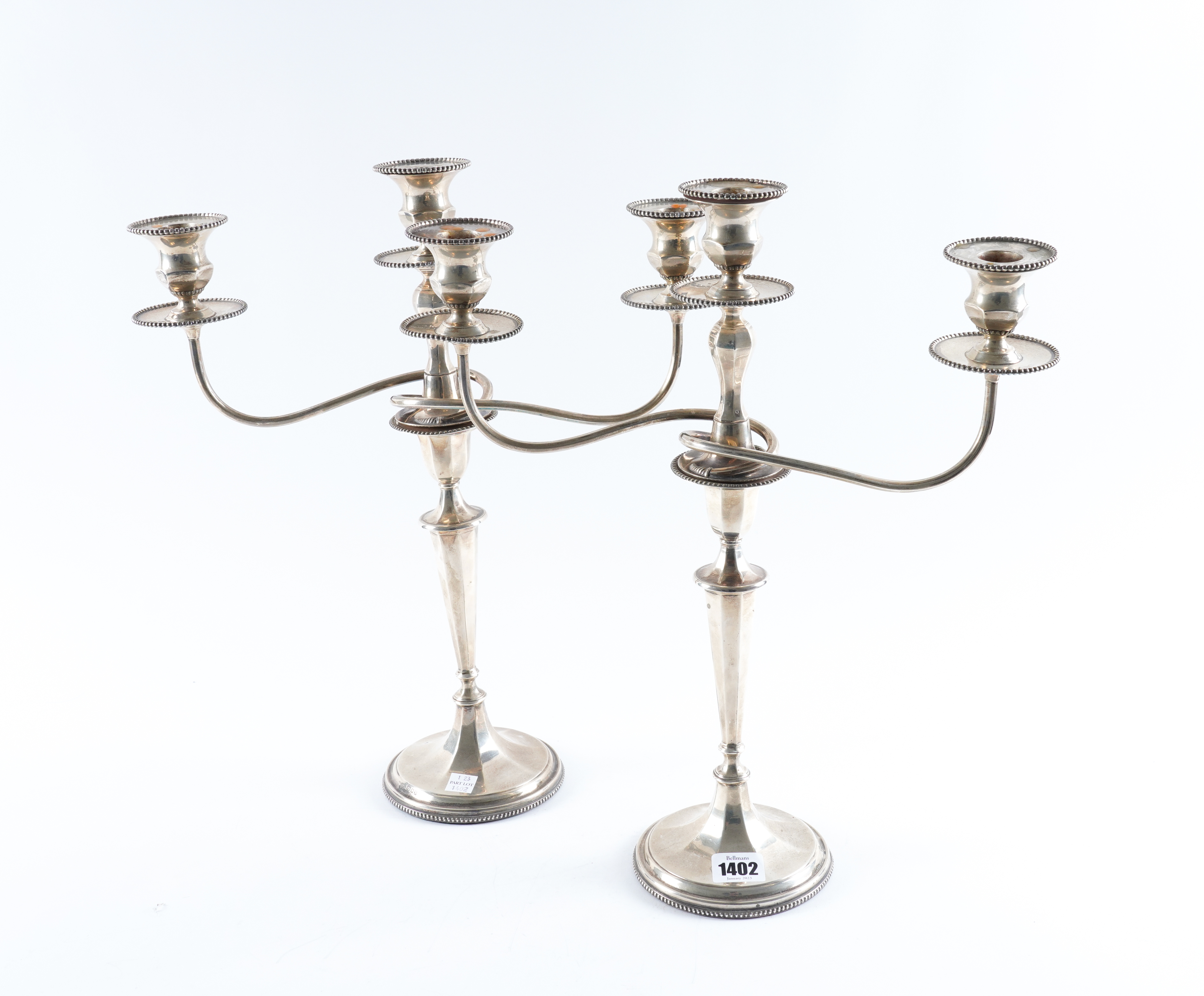 A PAIR OF SILVER TABLE CANDLESTICKS
