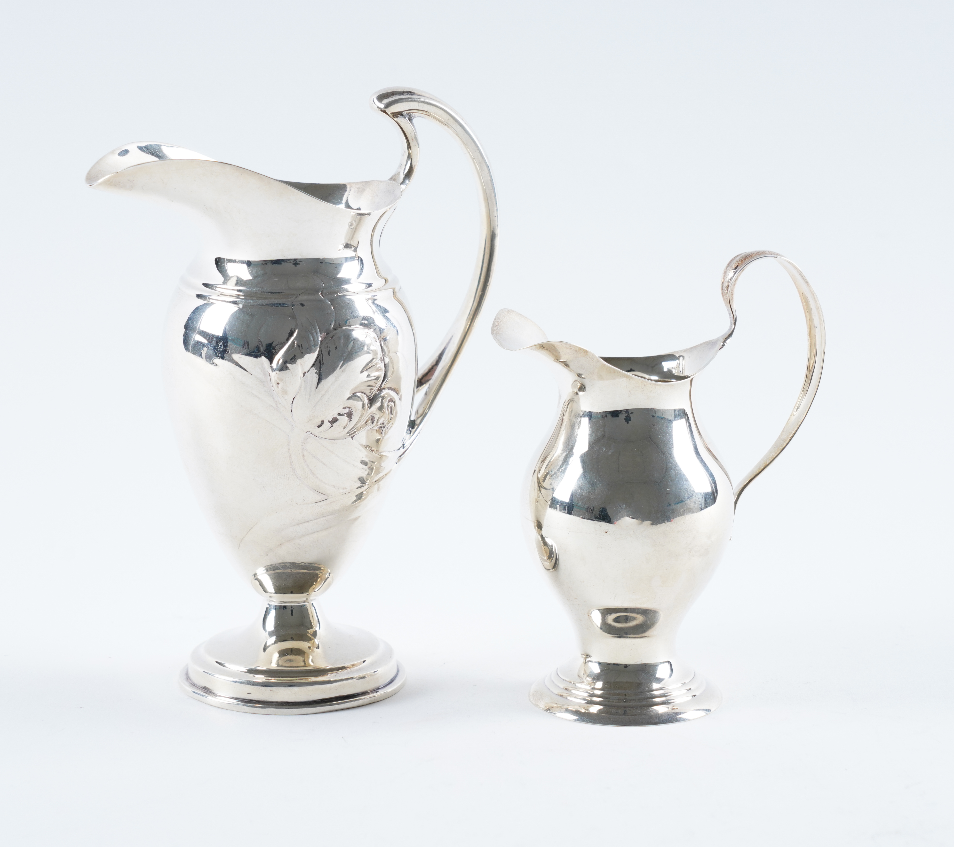 TWO SILVER CREAM JUGS (2) The larger
